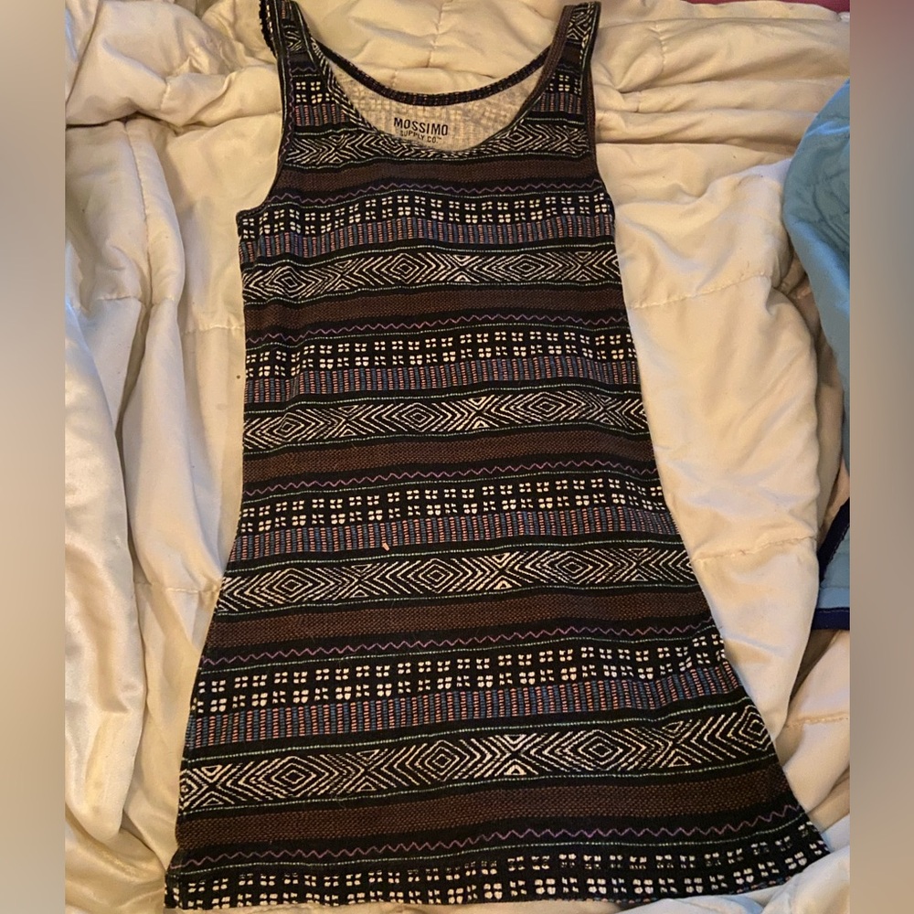 never worn, but no tags 95% cotton and 5% spandex, and just a cute tank top